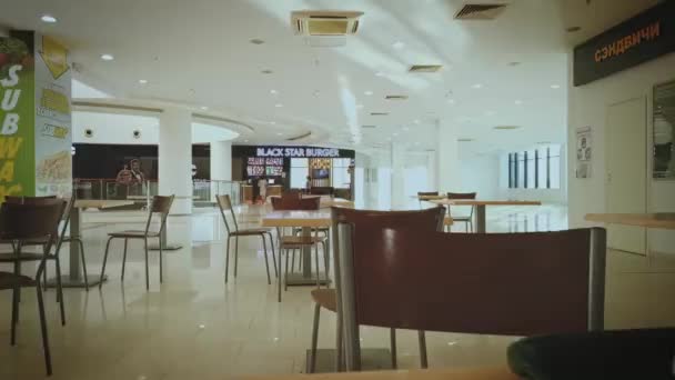 Astrakhan, Russia - 26 June 2021: Shot of a busy cafe in a OKEY mall food-court, people all motion blurr timelapse shot — Stock Video