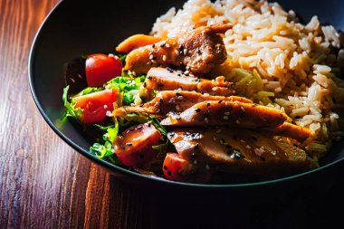 Food curry in bowl. Rice and chicken with fresh vegetables india buffet diet table.