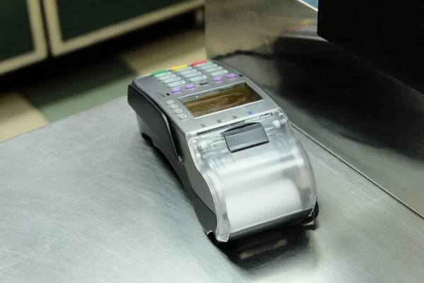 Empty cash desk with terminal — Stock Photo, Image