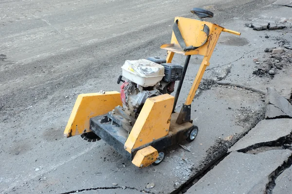 Circular small drill breaking street asphalt — Stock Photo, Image