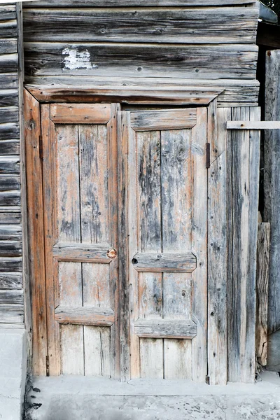 Ancient wooden door. Wooden door of old barn