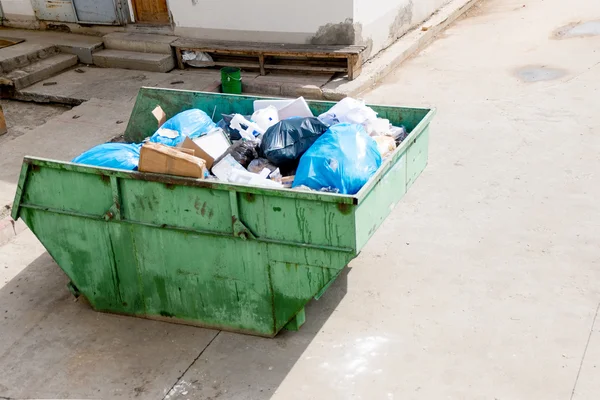 Overfilled trash dumpster from above view Stock Photo by ©mettus 69773429