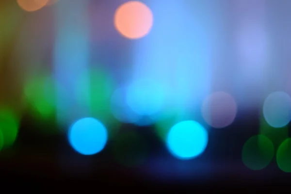 Un hermoso fondo de luces bokeh en la oscuridad — Foto de Stock