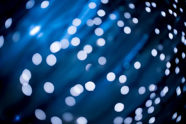 Abstracte achtergrond met licht en bokeh in blauwe kleur — Stockfoto