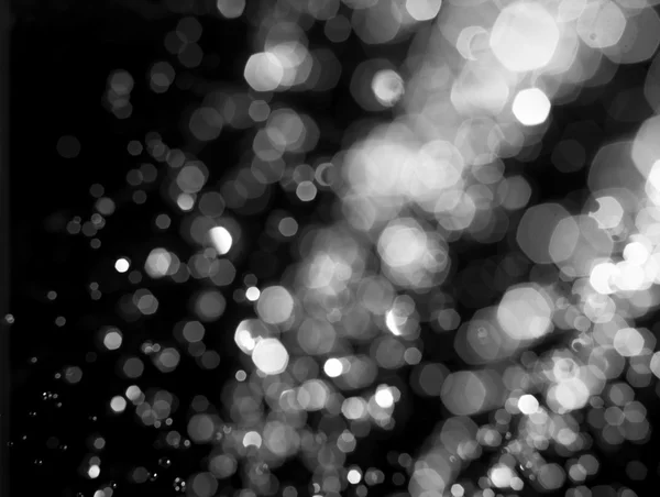 Nieve estilizada o gotas de lluvia brillan. Fondo bokeh circular abstracto de Navidad — Foto de Stock