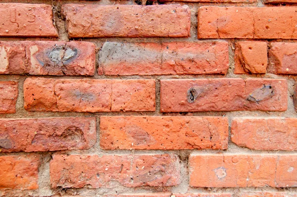 Fechar a parede de tijolo vermelho resistido — Fotografia de Stock