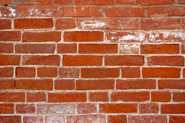 Rode bakstenen muur met vlekken — Stockfoto