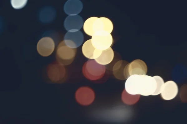 Bokeh de la luz de la noche de color, fondo borroso. — Foto de Stock