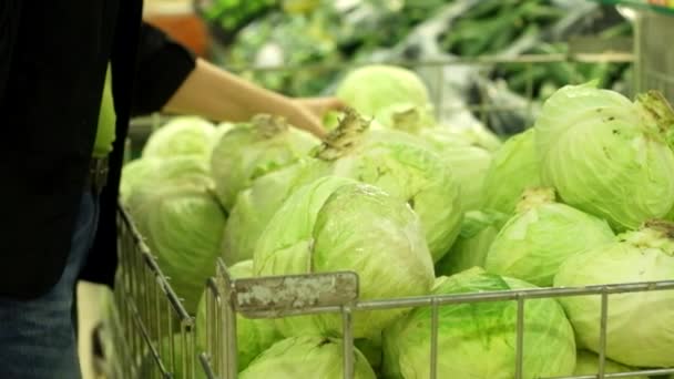 Woman buys  white cabbage — Stock Video