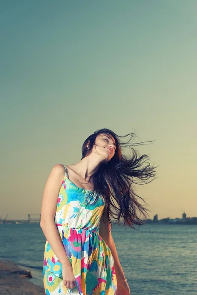 Waist Up Shot of Young Women on Seaside with wind fluttering her hair Royalty Free Stock Photos