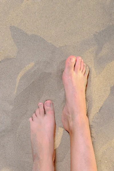 Woman feet with natural nail on beach, from above view, copy space — Stock Photo, Image