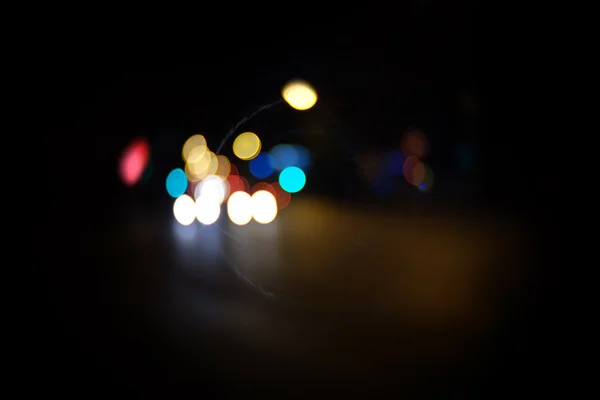 Carlights defocused in the night,  a lot of copyspace. — Stock Photo, Image