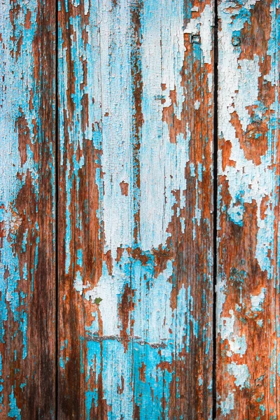 Verweerde houten planken die helft geschilderd in blauwe verticale afbeelding — Stockfoto