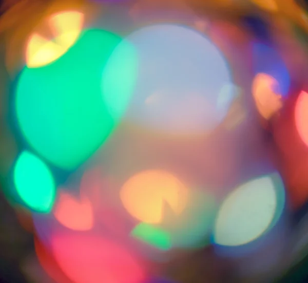 Karácsonyi fények ki a fókusz. Defocused színes karácsonyi háttérkép — Stock Fotó