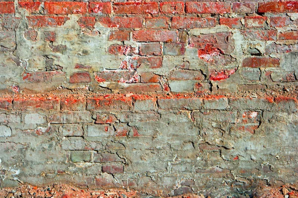 Red brick wall half covered with cement — Stock Photo, Image
