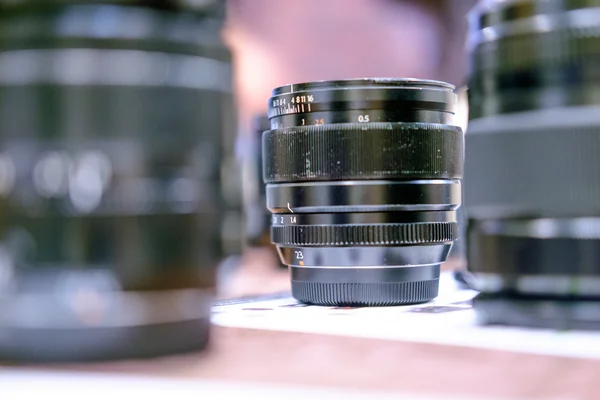 Old film lens on a table — Stock Photo, Image