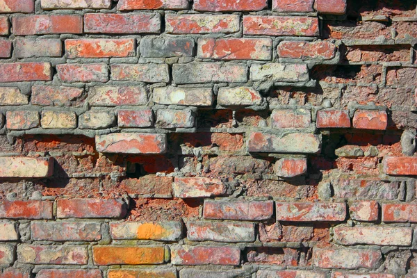 Gebarsten vintage bakstenen muur — Stockfoto