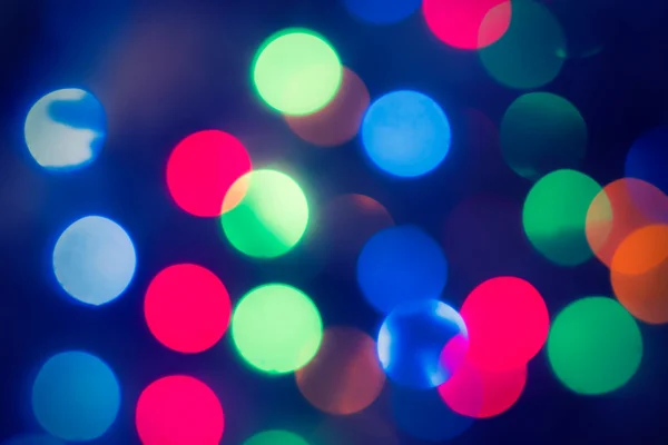 Christmas Background.  Holiday glowing Abstract Defocused Background With Blinking Lights. Blurred Bokeh. Retro Color Vintage photo — Stock Photo, Image