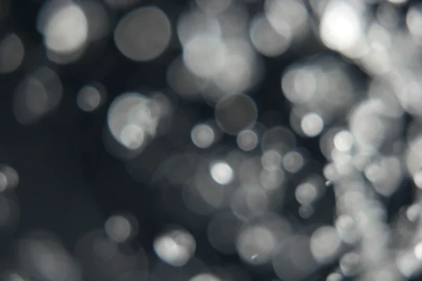 Bulanık kar. Glitter bokeh ışıklar bokeh arka plan defocused — Stok fotoğraf