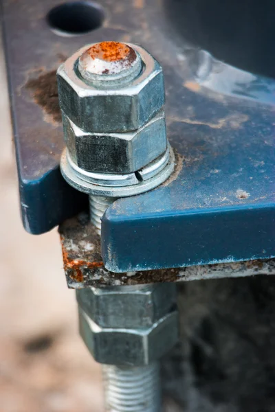 Large bolt and nut screwed on construction — Stock Photo, Image