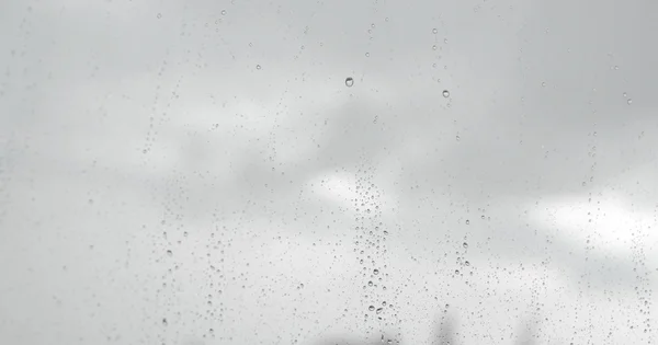 Drops of rain on the inclined window — Stock Photo, Image