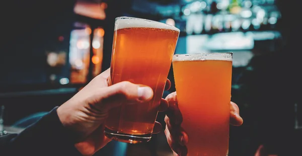 Closeup View Two Glass Beer Hand Beer Glasses Clinking Bar — Stock Photo, Image