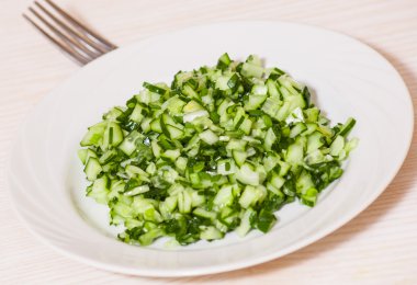 Green vegetable salad of cucumbers, spring onion