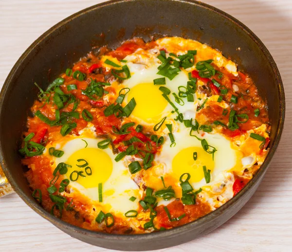 Eggs with vegetables in a frying pan — Stock Photo, Image