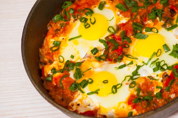 Eggs with vegetables in a frying pan — Stock Photo, Image