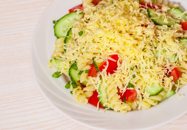 Pasta salad with cheese, tomato and cucumber — Stock Photo, Image