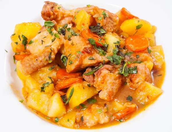 stewed meat with potatoes, onion and carrot