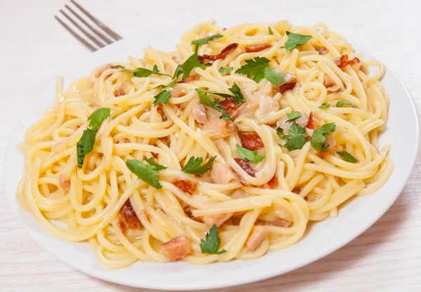 Spaghetti with fish sauce — Stock Photo, Image