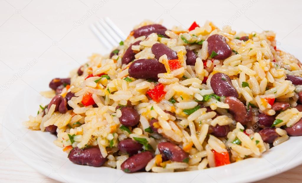 Rice with red beans and vegetables on plate