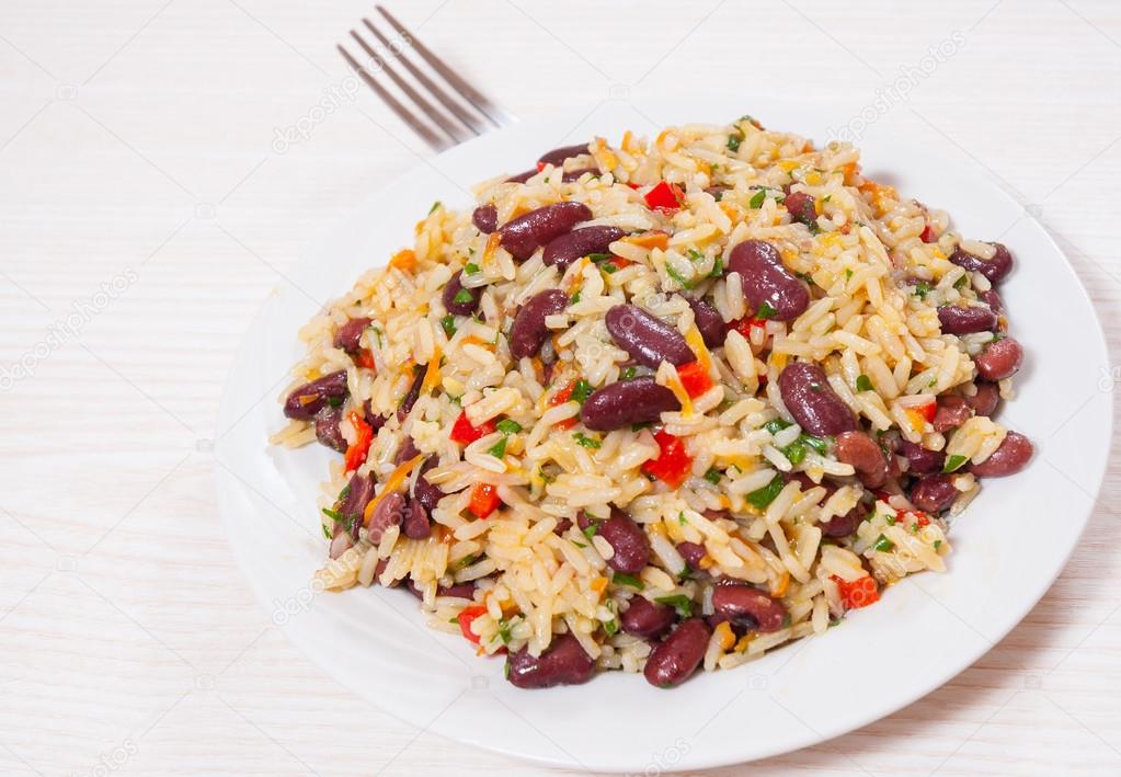 Rice with red beans and vegetables on plate