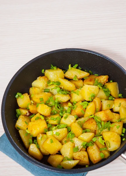 Roasted potatoes in a frying pan — Stock Photo, Image