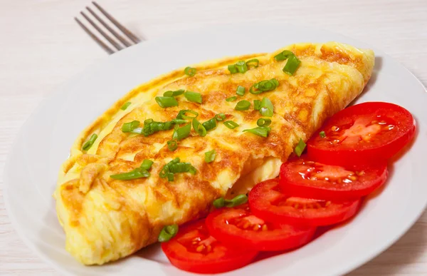 Omelette on white plate — Stock Photo, Image