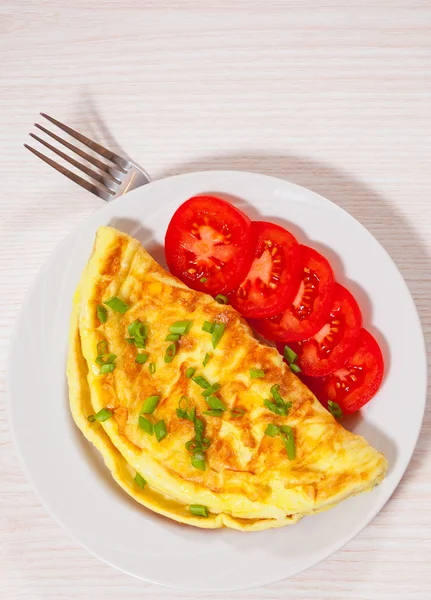 Omelette on white plate — Stock Photo, Image