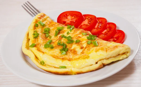 Omelette on white plate — Stock Photo, Image