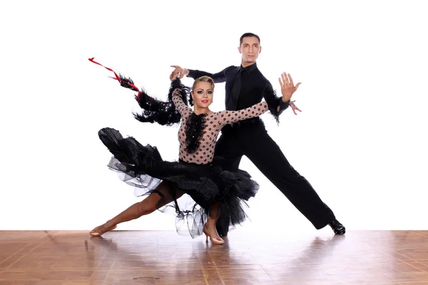 Latino dancers in ballroom against white background — Stock Photo, Image