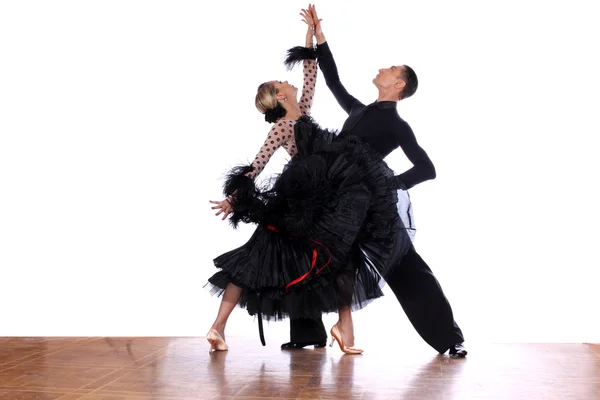 Latino dancers in ballroom against white background — Stock Photo, Image