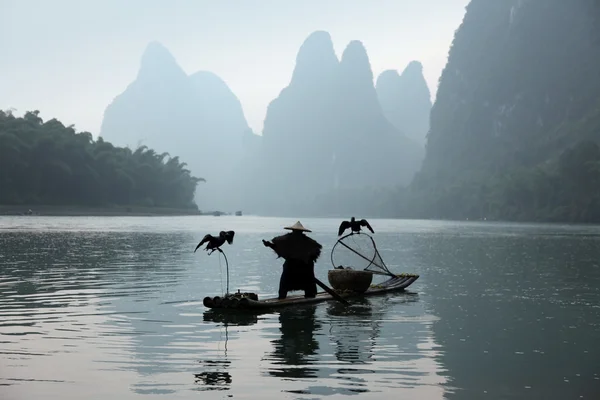 Homem chinês pesca — Fotografia de Stock