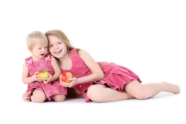 Little sisters with apples — Stock Photo, Image