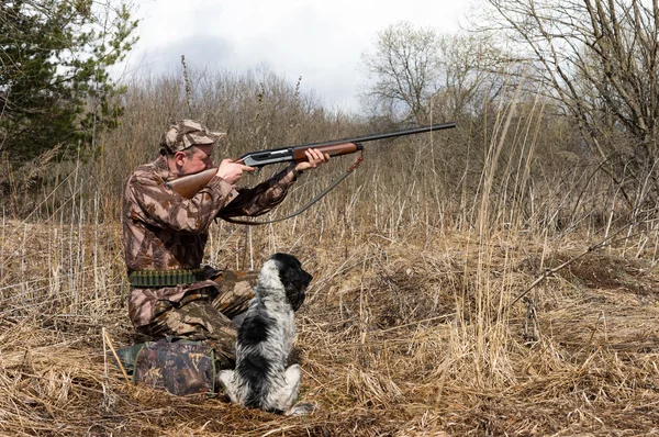 Hunter with a dog Stock Image