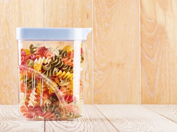 Multicolored Raw Spiral Pasta In Jar — Stock Photo, Image