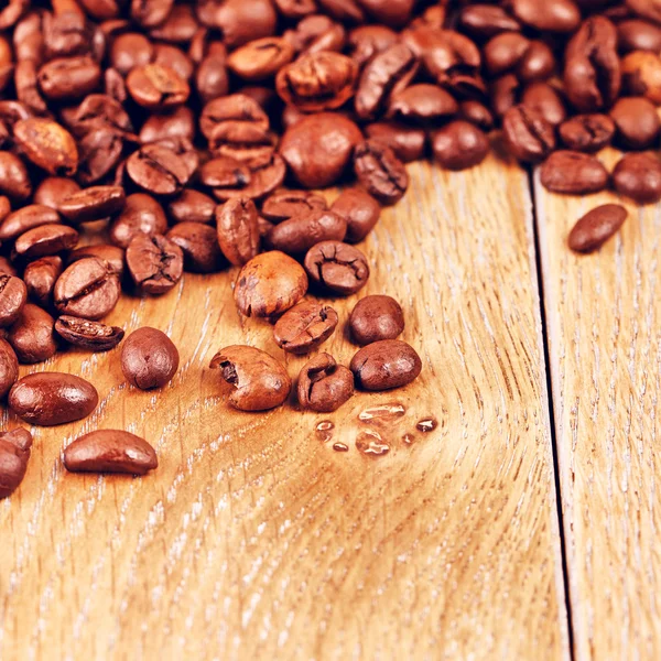 Coffee Beans On Wooden Table — Stock Photo, Image