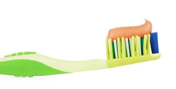 绿色的牙刷，用中草药牙膏 — 图库照片