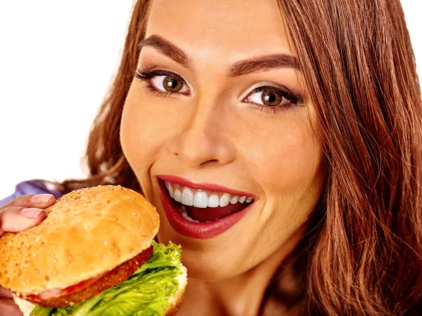 Ragazza che mangia panino grande. Isolato . — Foto Stock