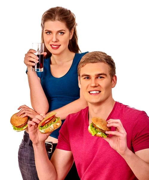 Homem e mulher comendo sanduíche grande com bebida. Isolados . — Fotografia de Stock