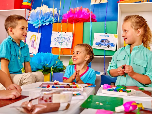 Group kids mold from plasticine  in kindergarten . — Stock Photo, Image