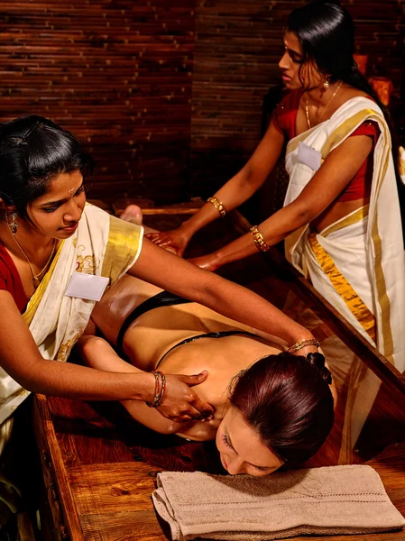 Woman having massage with pouch of rice. — Stock Photo, Image